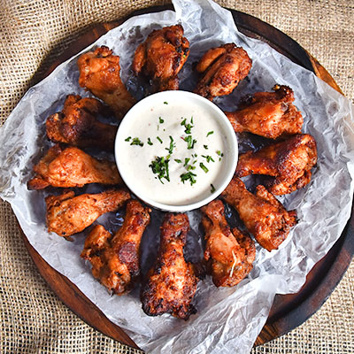 Oven Baked Wings - Fresh Oven Baked Wings Served With Dip Sauce To Satisfy Your Cravings.